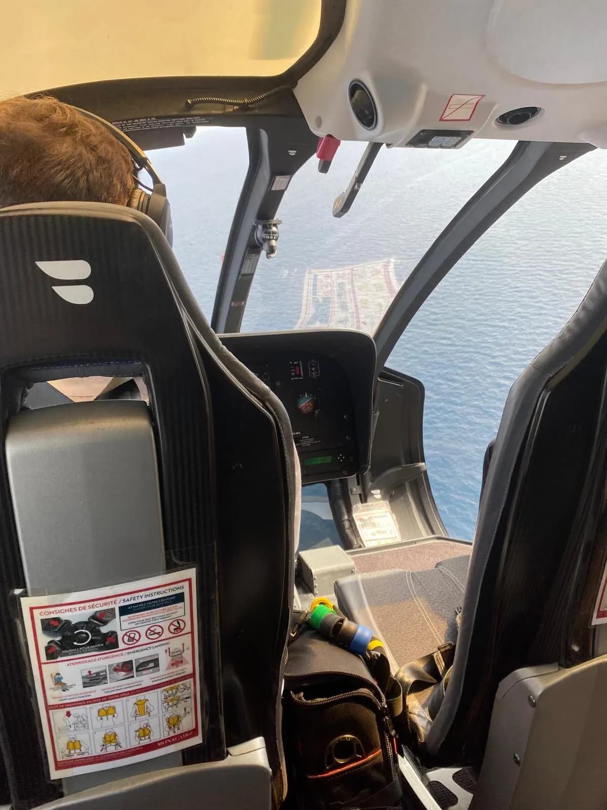 Helicopter pilot flying along the coast